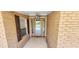 Front entry with tile flooring and a wood door at 3112 Santee River Rd, Saint Stephen, SC 29479