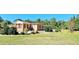 Brick home with covered porch and a large backyard at 3112 Santee River Rd, Saint Stephen, SC 29479