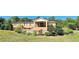 Ranch-style brick home with landscaped yard and fenced area at 3112 Santee River Rd, Saint Stephen, SC 29479