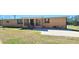 Brick ranch home with covered porch and large yard at 3112 Santee River Rd, Saint Stephen, SC 29479