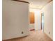 Bright hallway with wood cabinets and carpet flooring at 3112 Santee River Rd, Saint Stephen, SC 29479