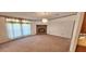 Spacious living room featuring a stone fireplace and large windows at 3112 Santee River Rd, Saint Stephen, SC 29479