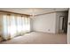 Spacious living room with carpeted floor and large windows at 3112 Santee River Rd, Saint Stephen, SC 29479