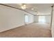 Large living room with two ceiling fans and carpeted floors at 3112 Santee River Rd, Saint Stephen, SC 29479