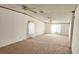 Large living room with two ceiling fans and carpeted floors at 3112 Santee River Rd, Saint Stephen, SC 29479