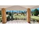 Covered porch overlooking a spacious backyard at 3112 Santee River Rd, Saint Stephen, SC 29479