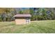 Brick storage shed with metal roof and security gate at 3112 Santee River Rd, Saint Stephen, SC 29479