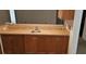 Home features a wet bar with wood cabinets and tile backsplash at 3112 Santee River Rd, Saint Stephen, SC 29479