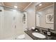 Modern bathroom with a walk-in shower, dark countertop and neutral colors at 456 Vetch Ct, Kiawah Island, SC 29455