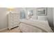Serene bedroom with a white dresser, light walls, and natural light at 456 Vetch Ct, Kiawah Island, SC 29455