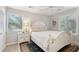Charming bedroom with a white wooden bed frame, light walls and window blinds at 456 Vetch Ct, Kiawah Island, SC 29455