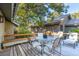 Deck with table and chairs, offering scenic backyard views at 456 Vetch Ct, Kiawah Island, SC 29455