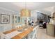 Open concept dining area with view into living room and fireplace at 456 Vetch Ct, Kiawah Island, SC 29455
