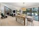 Open concept dining area with wood table and access to deck at 456 Vetch Ct, Kiawah Island, SC 29455