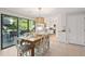 Bright dining area with wooden table and access to deck at 456 Vetch Ct, Kiawah Island, SC 29455
