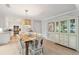 Bright dining area with farmhouse table and built-in hutch at 456 Vetch Ct, Kiawah Island, SC 29455