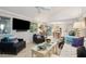 Open living room with hardwood floors, a view into the kitchen, and comfy seating at 456 Vetch Ct, Kiawah Island, SC 29455