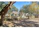 Charming light green house with wooden fence and mature trees in the front yard at 4632 Holmes Ave, North Charleston, SC 29405