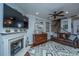 Living room with fireplace, hardwood floors, and leather sofas at 5150 Trump St # 1905, North Charleston, SC 29420