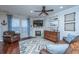 Living room with fireplace, hardwood floors, and leather sofas at 5150 Trump St # 1905, North Charleston, SC 29420