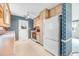 View of kitchen with wood cabinets, pink countertops, and white appliances at 648 Schooner Rd, Charleston, SC 29412