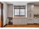 Modern kitchen with gray cabinets, wood countertop and a wine refrigerator at 65 Spring St, Charleston, SC 29403