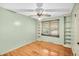 Light green bedroom with hardwood floors and built-in shelves at 7 Andrea Ct, Hanahan, SC 29410