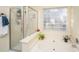 Bathroom with a shower, bathtub, and block window at 7011 Windmill Creek Rd, Charleston, SC 29414