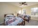 Well-lit bedroom featuring two twin beds and large windows at 7011 Windmill Creek Rd, Charleston, SC 29414