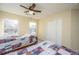 Bright bedroom with two twin beds, ample closet space, and a view of a pond at 7011 Windmill Creek Rd, Charleston, SC 29414