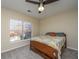 Bedroom with a queen bed, window view, and ceiling fan at 7011 Windmill Creek Rd, Charleston, SC 29414
