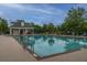 Enjoy resort-style pool with a pool house and lounge chairs at 7011 Windmill Creek Rd, Charleston, SC 29414
