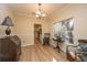 Spacious dining room with hardwood floors and adjacent kitchen view at 7011 Windmill Creek Rd, Charleston, SC 29414