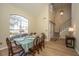 Dining room with large window, hardwood floors, and view of entryway at 7011 Windmill Creek Rd, Charleston, SC 29414