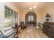 Sunlit dining room with hardwood floors and view into living room at 7011 Windmill Creek Rd, Charleston, SC 29414