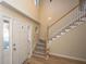 Two-story entryway with hardwood floors, staircase, and front door at 7011 Windmill Creek Rd, Charleston, SC 29414