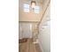 Bright entryway with hardwood floors, staircase, and natural light at 7011 Windmill Creek Rd, Charleston, SC 29414