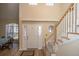Inviting entryway with hardwood floors, staircase, and front door at 7011 Windmill Creek Rd, Charleston, SC 29414