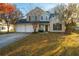 Two-story house with two-car garage and landscaped yard at 7011 Windmill Creek Rd, Charleston, SC 29414