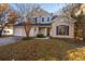 Two-story stucco home with a two-car garage and landscaped lawn at 7011 Windmill Creek Rd, Charleston, SC 29414