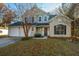 Two-story house with two-car garage and landscaped yard at 7011 Windmill Creek Rd, Charleston, SC 29414