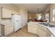 Open kitchen with island, white cabinets, and stainless steel appliances at 7011 Windmill Creek Rd, Charleston, SC 29414