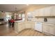 Kitchen boasts white cabinets, stainless steel appliances, and breakfast bar at 7011 Windmill Creek Rd, Charleston, SC 29414