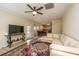 Living room with sectional sofa, fireplace, and hardwood floors at 7011 Windmill Creek Rd, Charleston, SC 29414