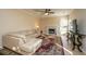 Living room with sectional sofa, fireplace, and hardwood floors at 7011 Windmill Creek Rd, Charleston, SC 29414