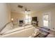 Living room features a fireplace, flat-screen TV, and backyard access at 7011 Windmill Creek Rd, Charleston, SC 29414
