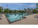 Community pool with lounge chairs and a pool house at 7011 Windmill Creek Rd, Charleston, SC 29414