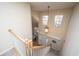 View from the top of the staircase, looking down into the foyer at 7011 Windmill Creek Rd, Charleston, SC 29414