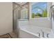 Bathroom with soaking tub and walk-in shower at 768 Maynard Ln, Summerville, SC 29486
