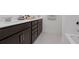 Bathroom with dark brown vanity and white countertop at 768 Maynard Ln, Summerville, SC 29486